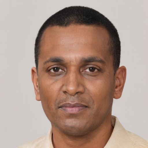 Neutral black adult male with short  black hair and brown eyes