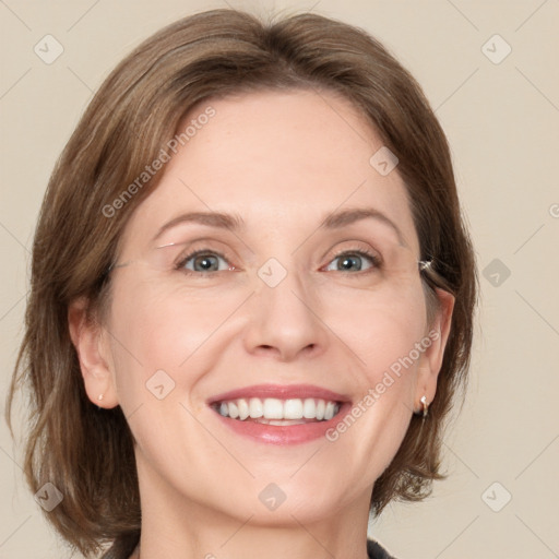 Joyful white adult female with medium  brown hair and grey eyes