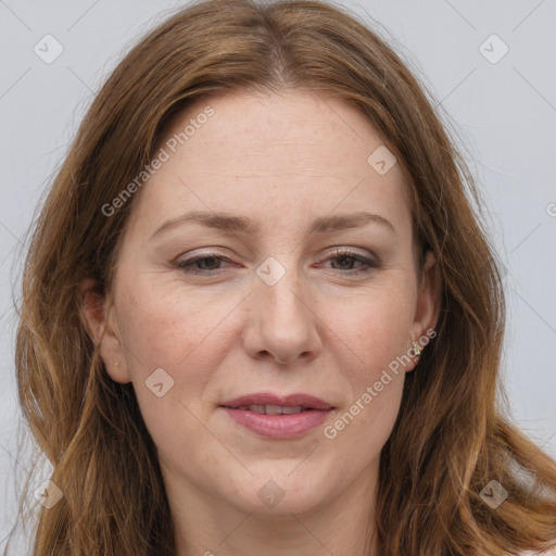 Joyful white adult female with long  brown hair and grey eyes