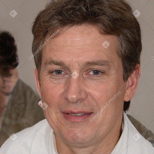 Joyful white middle-aged male with short  brown hair and brown eyes