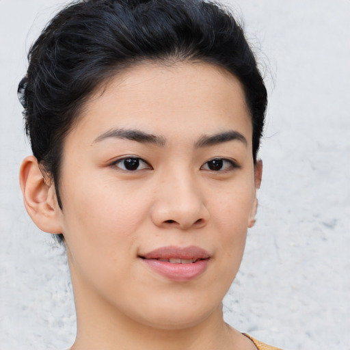 Joyful asian young-adult female with short  brown hair and brown eyes