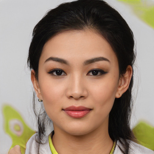 Joyful latino young-adult female with medium  black hair and brown eyes