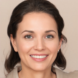 Joyful white young-adult female with medium  brown hair and brown eyes