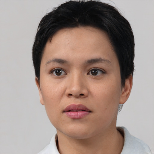 Neutral white young-adult female with short  black hair and brown eyes