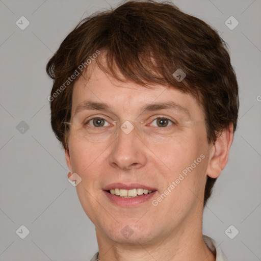 Joyful white adult male with short  brown hair and grey eyes