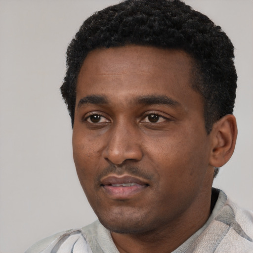 Neutral black young-adult male with short  black hair and brown eyes