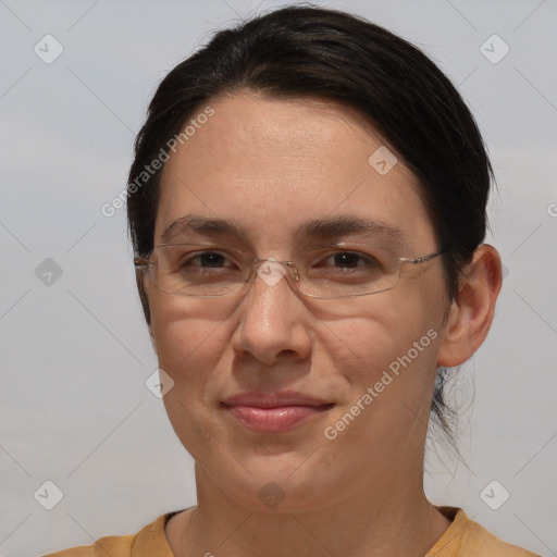 Joyful white adult female with short  brown hair and brown eyes