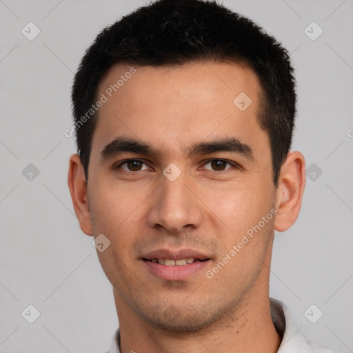 Joyful white young-adult male with short  black hair and brown eyes