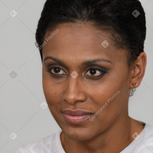 Joyful black young-adult female with short  brown hair and brown eyes