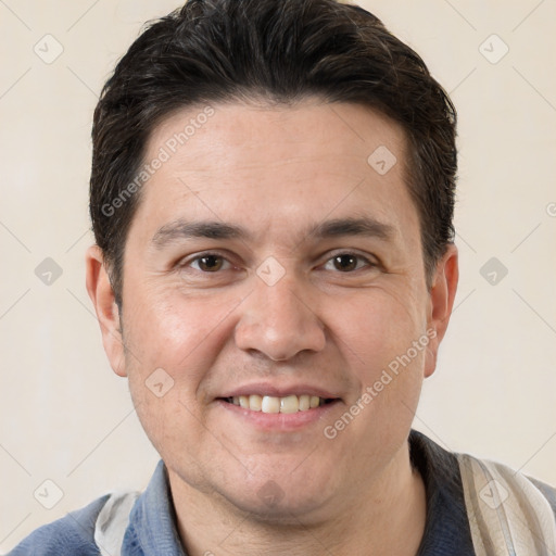 Joyful white adult male with short  brown hair and brown eyes