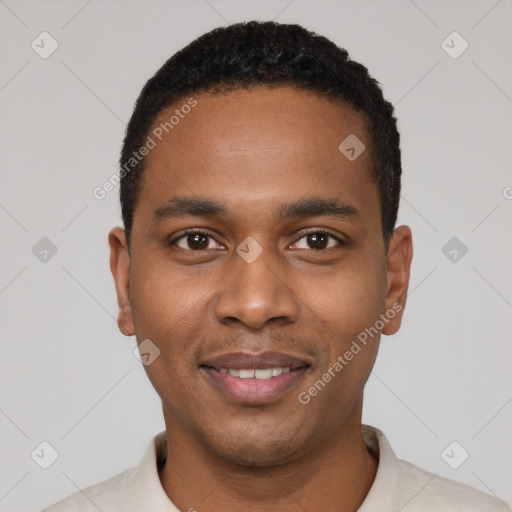 Joyful black young-adult male with short  black hair and brown eyes