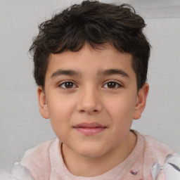 Joyful white child male with short  brown hair and brown eyes