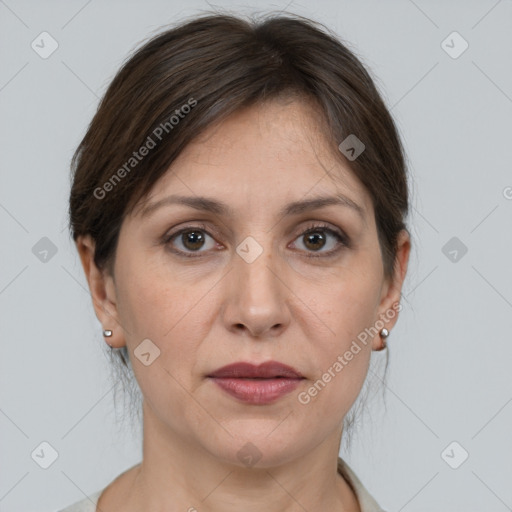 Joyful white adult female with medium  brown hair and grey eyes