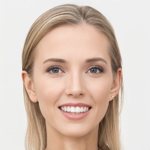 Joyful white young-adult female with long  brown hair and grey eyes