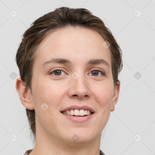 Joyful white young-adult female with short  brown hair and grey eyes