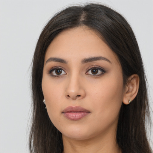 Neutral latino young-adult female with long  brown hair and brown eyes