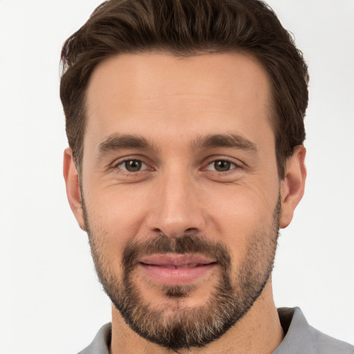 Joyful white young-adult male with short  brown hair and brown eyes