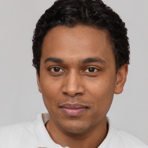 Neutral black young-adult male with short  black hair and brown eyes