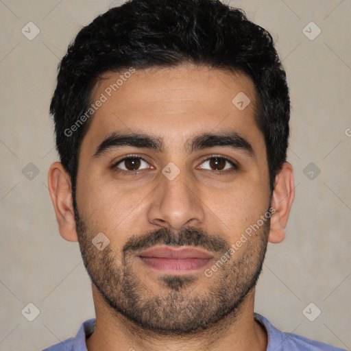 Joyful latino young-adult male with short  black hair and brown eyes