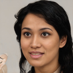 Joyful latino young-adult female with medium  black hair and brown eyes