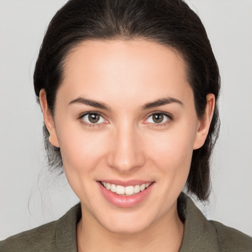 Joyful white young-adult female with medium  brown hair and brown eyes