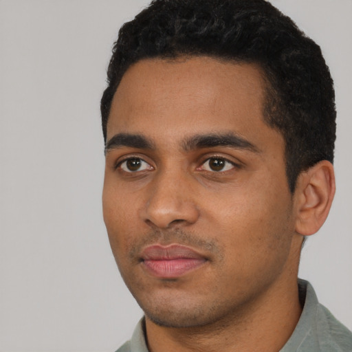 Neutral black young-adult male with short  black hair and brown eyes