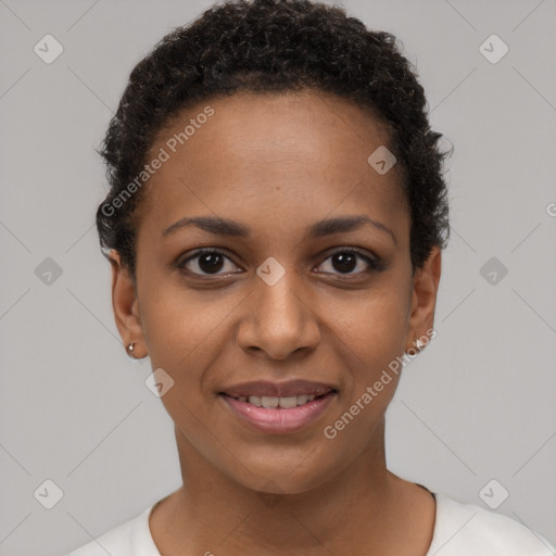 Joyful black young-adult female with short  brown hair and brown eyes