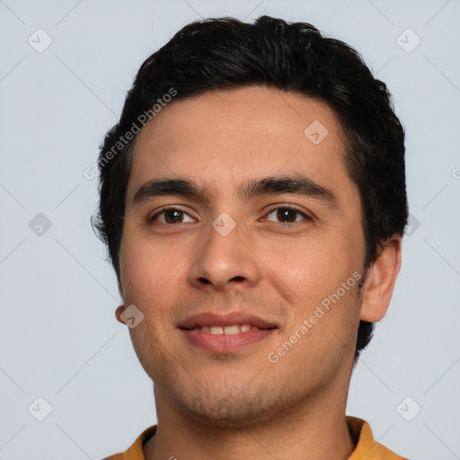 Joyful white young-adult male with short  black hair and brown eyes