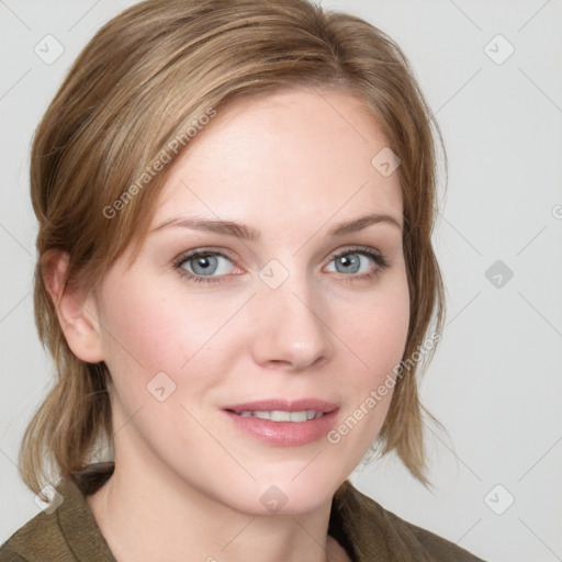 Joyful white young-adult female with medium  brown hair and blue eyes