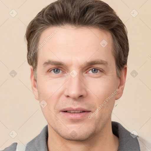 Joyful white adult male with short  brown hair and grey eyes