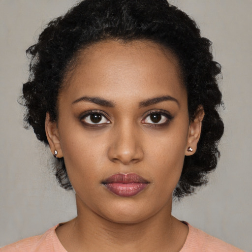 Neutral black young-adult female with short  black hair and brown eyes
