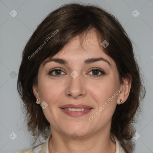 Joyful white adult female with medium  brown hair and brown eyes