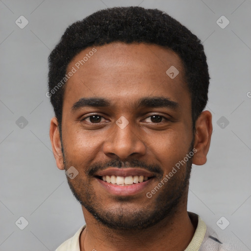 Joyful black young-adult male with short  black hair and brown eyes