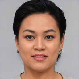 Joyful asian young-adult female with short  black hair and brown eyes