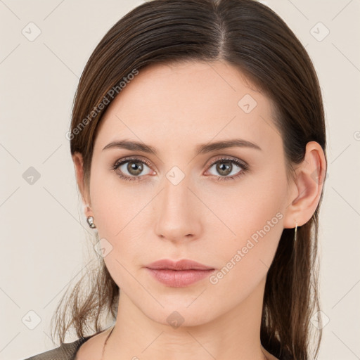 Neutral white young-adult female with long  brown hair and brown eyes