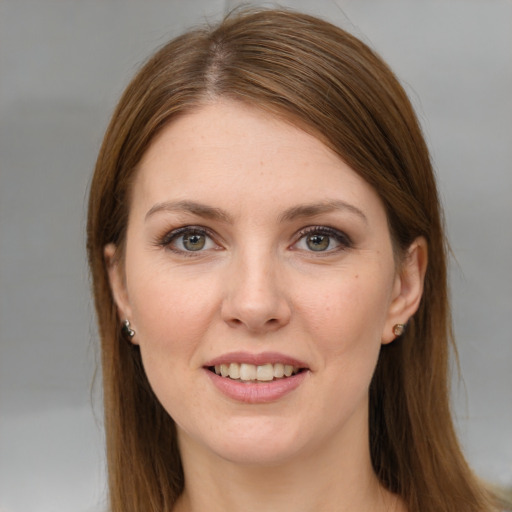 Joyful white young-adult female with long  brown hair and grey eyes