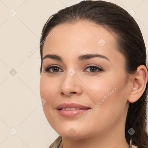 Joyful white young-adult female with long  brown hair and brown eyes