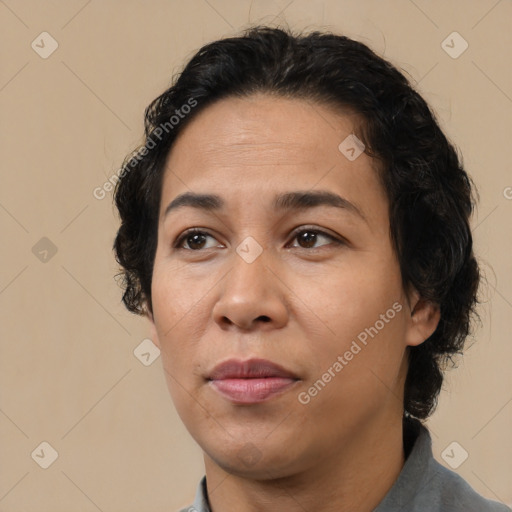 Joyful latino adult female with medium  brown hair and brown eyes