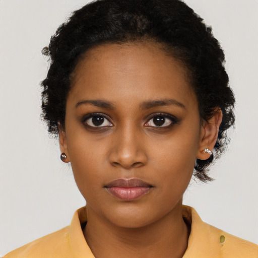 Neutral black young-adult female with short  black hair and brown eyes