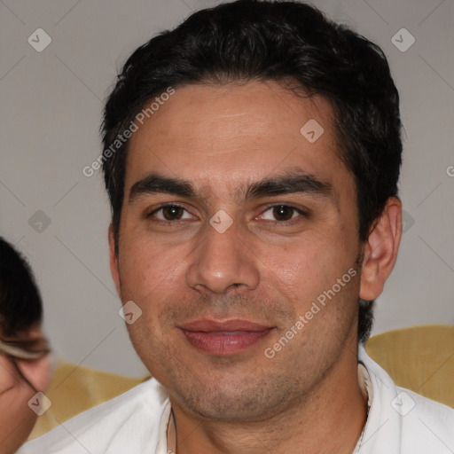 Joyful white young-adult male with short  black hair and brown eyes