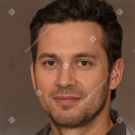 Joyful white adult male with short  brown hair and brown eyes