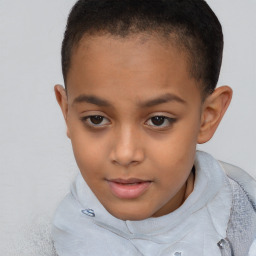 Joyful white child female with short  brown hair and brown eyes