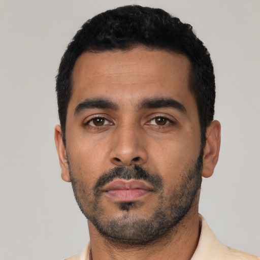 Neutral latino young-adult male with short  black hair and brown eyes