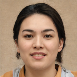 Joyful asian young-adult female with medium  brown hair and brown eyes