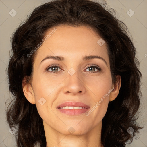 Joyful white adult female with medium  brown hair and brown eyes