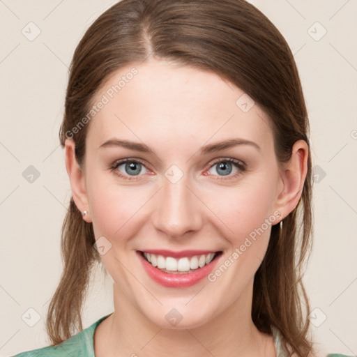 Joyful white young-adult female with medium  brown hair and blue eyes