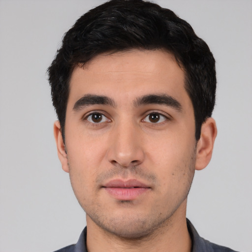Neutral white young-adult male with short  black hair and brown eyes