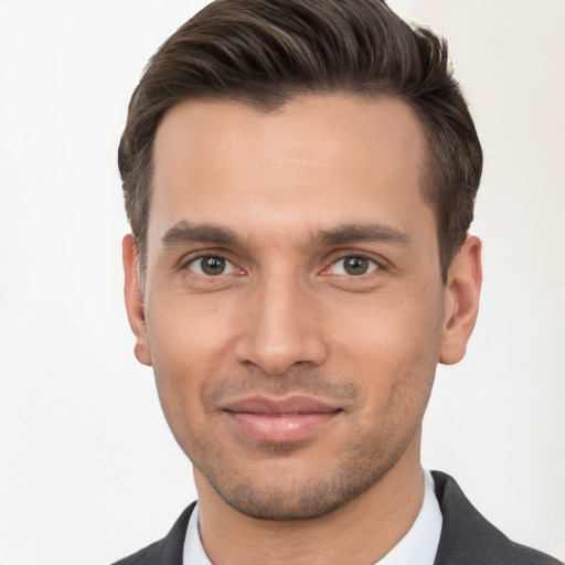 Joyful white young-adult male with short  brown hair and brown eyes