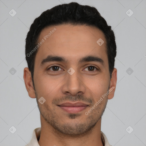 Joyful latino young-adult male with short  black hair and brown eyes