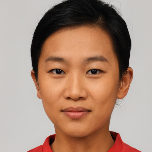 Joyful asian young-adult female with short  brown hair and brown eyes